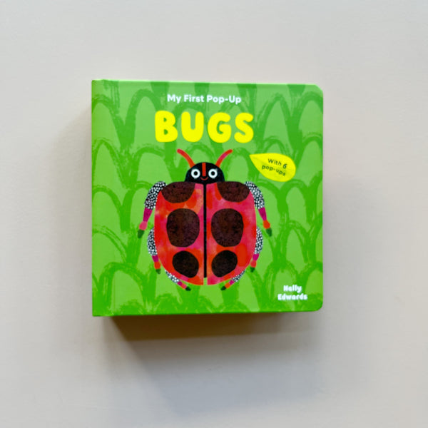 My First Pop-Up Bugs by Nelly Edwards hardcover kids book with a bright green cover featuring a ladybug illustration on a neutral background.