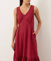 Red dress worn by a person on a plain background