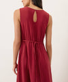 Red keyhole dress with a tie back belt on a plain background