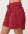 Red shorts with a tie waist on a white background