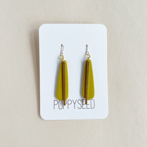 Chartreuse earrings with gold brass on a white card with 'Poppyseed' branding against a beige background