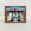 Packaging of Portland Syrups with three bottles inside on a white background