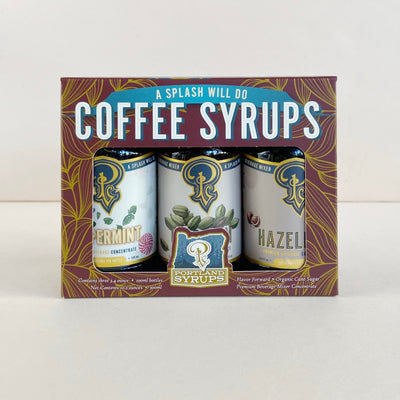 Packaging of Portland Syrups with three bottles inside on a white background