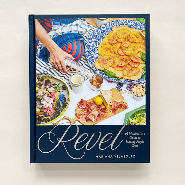 Cookbook titled 'Revel' by Mariana Velásquez with images of food on the cover
