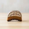 Facial lymphatic dry brush with bristle head on a light background