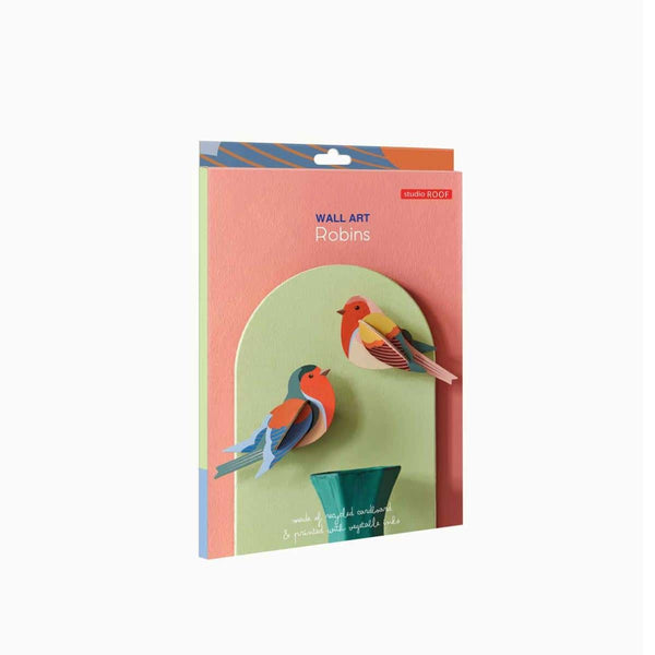 Packaged wall art with bird designs on a white background