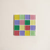Square tile with colorful square pattern on a beige background