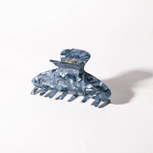 Blue crystal hair clip on a white background