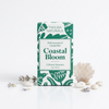 Teal and white 'Thulisa Naturals Coastal Bloom' shower steamers on a white background.