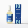 Bottle and box of umanos Wavemaker Texture Spray on a white background