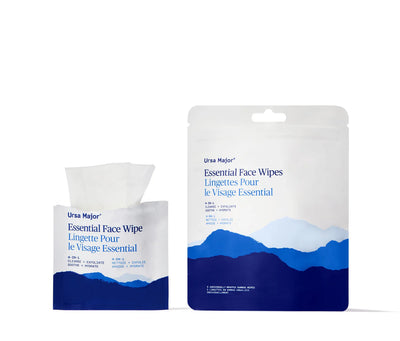 Two packages of Ursa Major brand essential face wipes on a white background