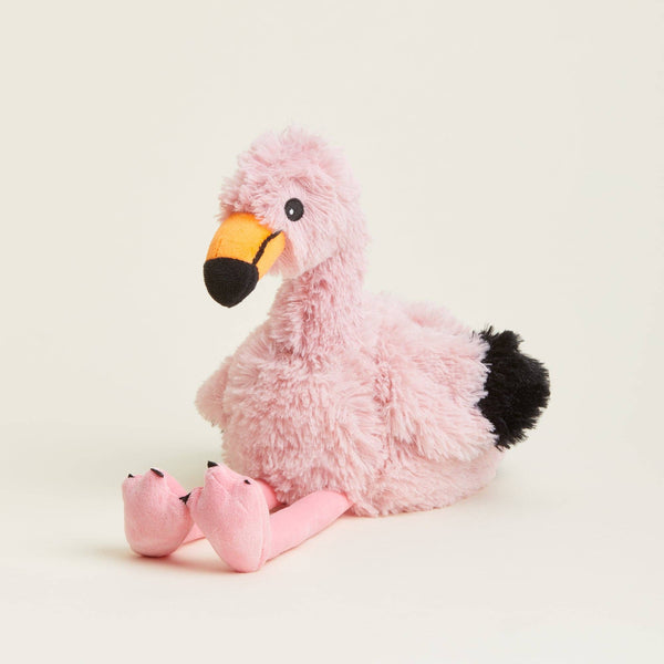 Plush flamingo toy on a beige background
