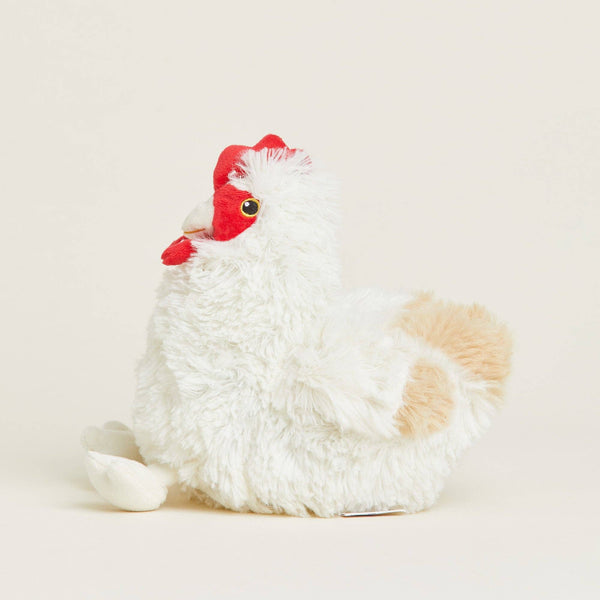 Plush toy chicken with a red head on a light beige background