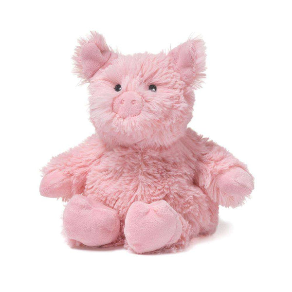 Pink plush pig toy on a white background