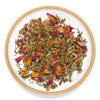 Colorful loose leaf tea on a white plate with a wooden rim
