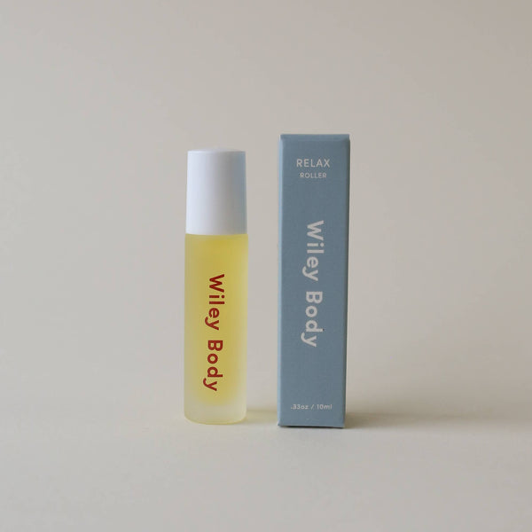 Yellow bottle and blue box labeled 'Wiley Body' on a beige background.