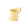 Yellow ceramic mug on a white background