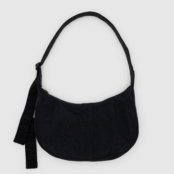 A black nylon crescent crossbody bag against a white background.