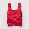 Red polka dot reusable bag on a light gray background