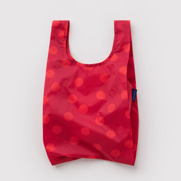 Red polka dot reusable bag on a light gray background
