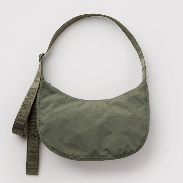 An olive green nylon crescent crossbody bag against a white background.