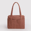 A tan and brown houndstooth nylon carry-on bag against a white background.