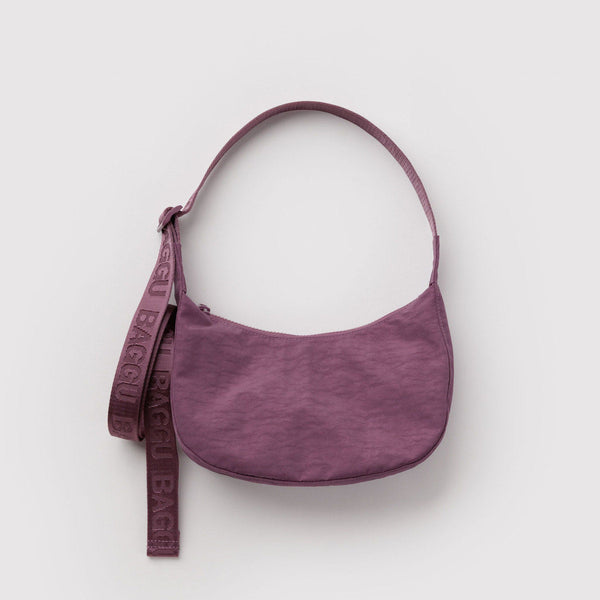Dusky purple small nylon crescent crossbody bag against a white background.