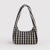A small nylon shoulder bag in a black and off-white gingham print on a white background.