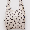 Cream reusable bag with black polka dots on a white background