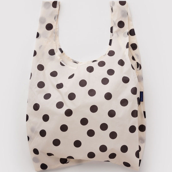 Cream reusable bag with black polka dots on a white background