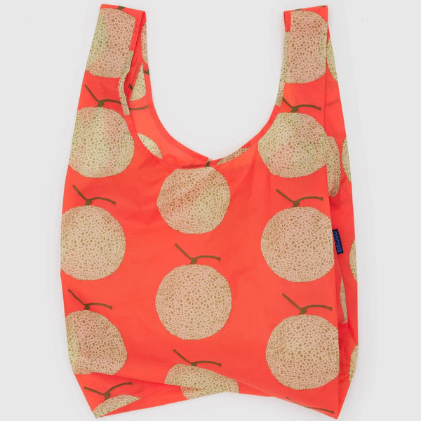 A bright orange reusable bag with a pattern of melons against a white background.