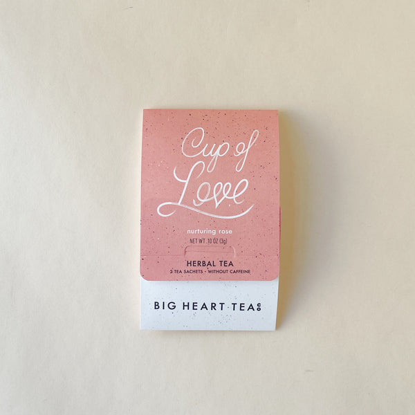 A pink packet of Big Heart Teas, Cup of Love herbal tea, with two tea bags included.