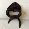 A brown-black fuzzy cashmere-wool blend triangle cravat scarf looped against a white marble backdrop.