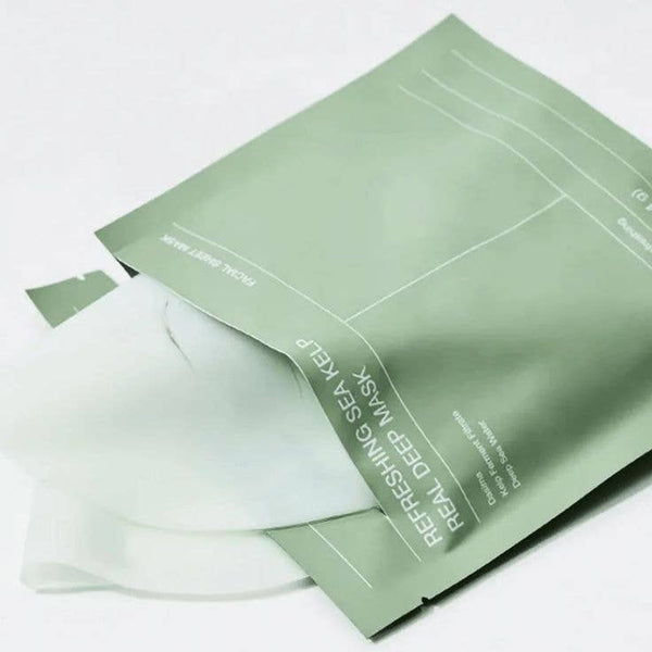 Green facial mask packaging on a white background