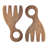 Two wooden salad servers shaped like large forks with round holes on the handles for hanging, lying against a white background.