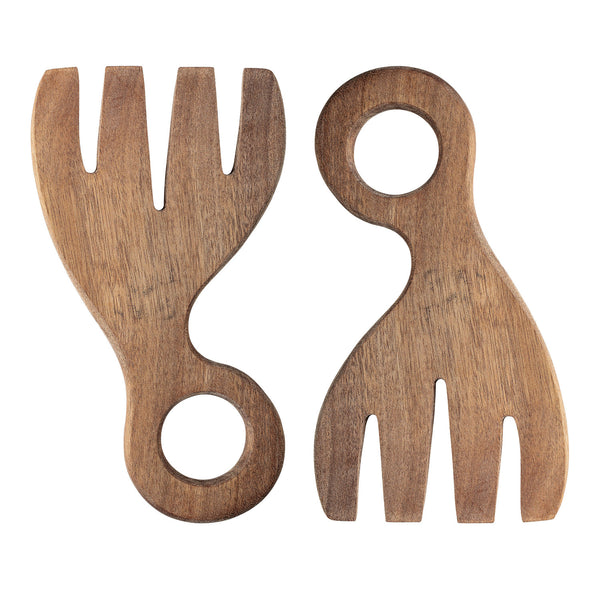 Two wooden salad servers shaped like large forks with round holes on the handles for hanging, lying against a white background.