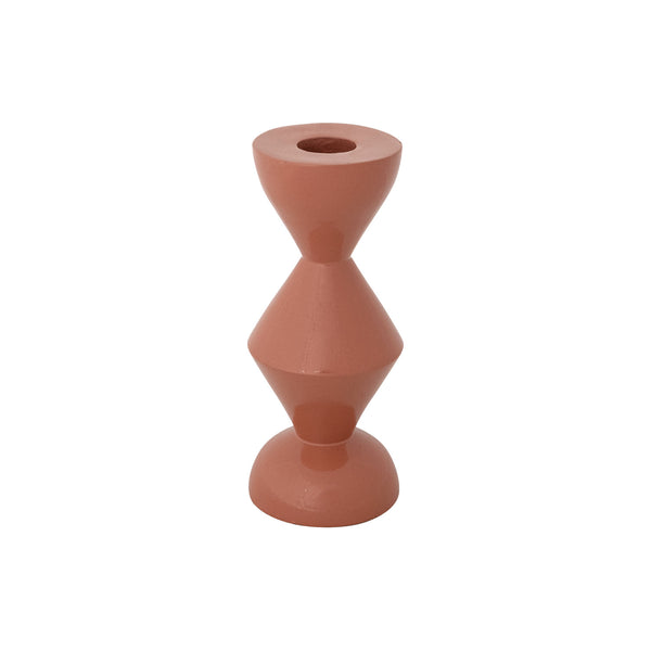 A rust orange aluminum taper candle holder in a textured zig-zag shape against a white background. 