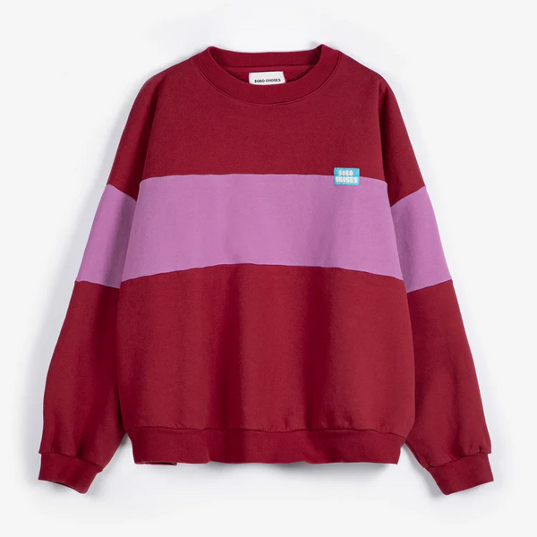 Color-blocked sweatshirt with maroon and pink sections on a white background