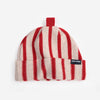 A red and white striped wool beanie hat with a red top and a small black 'Bobo Choses' label against a white background.