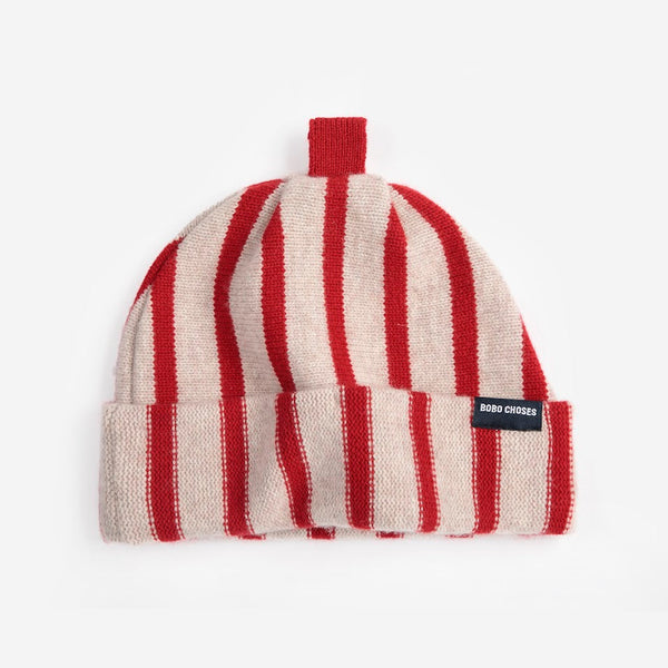 A red and white striped wool beanie hat with a red top and a small black 'Bobo Choses' label against a white background.