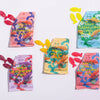 A collection of Swedish Fish candy packets in various flavors, including Sour Blackberry, Sour Peach, Wild Strawberry, and Sour Elderflower. The packets feature colorful designs with illustrations of fish.