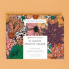 An adult coloring book titled 'Vintage Blooms' by Breathe People, shown centered on a warm peach background. The cover features dense illustrated flowers and leaves in muted orange, pink, purple, teal, and brown tones with a white title panel.