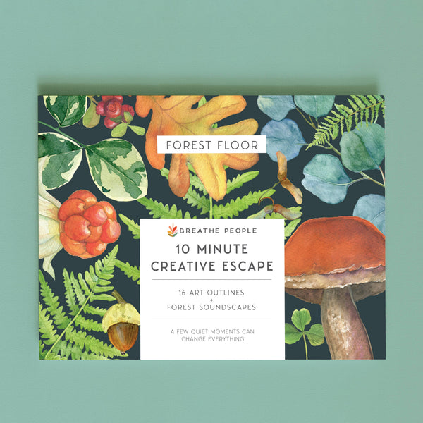An adult coloring book titled 'Forest Floor' by Breathe People, featuring illustrated forest elements like leaves, mushrooms, acorns, and orange leaves on a dark background, centered on a muted green backdrop.