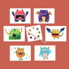 Set of six playful monster watercolor illustrated postcards along with a paintbrush and dry dot watercolor palette against a rust red background.