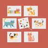 Set of six cute kitty watercolor postcards with a paintbrush and dry dot paint palette on a rust red background.