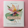 An art workbook titled 'Meditative Art with Watercolor' by Breathe People, featuring a watercolor lotus flower illustration, photographed flat against a pink background.