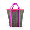 Tote bag with pink handles and dark multicolored pattern on a white background