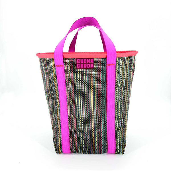 Tote bag with pink handles and dark multicolored pattern on a white background