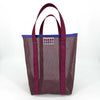 Dark purple-brown mesh tote bag with berry purple handles and blue trim on a white background