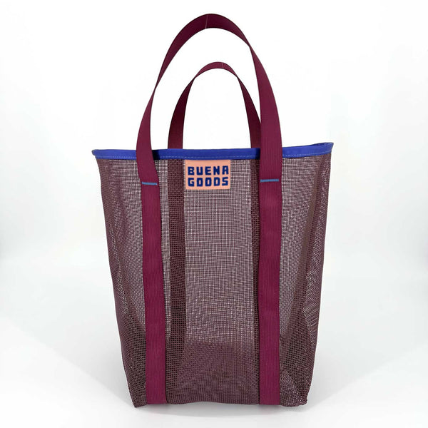 Dark purple-brown mesh tote bag with berry purple handles and blue trim on a white background
